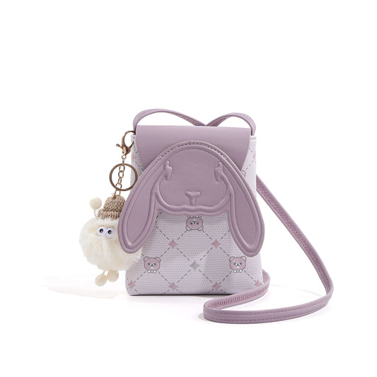 Light purple mini crossbody bag with bunny ear flap and white fluffy bear charm